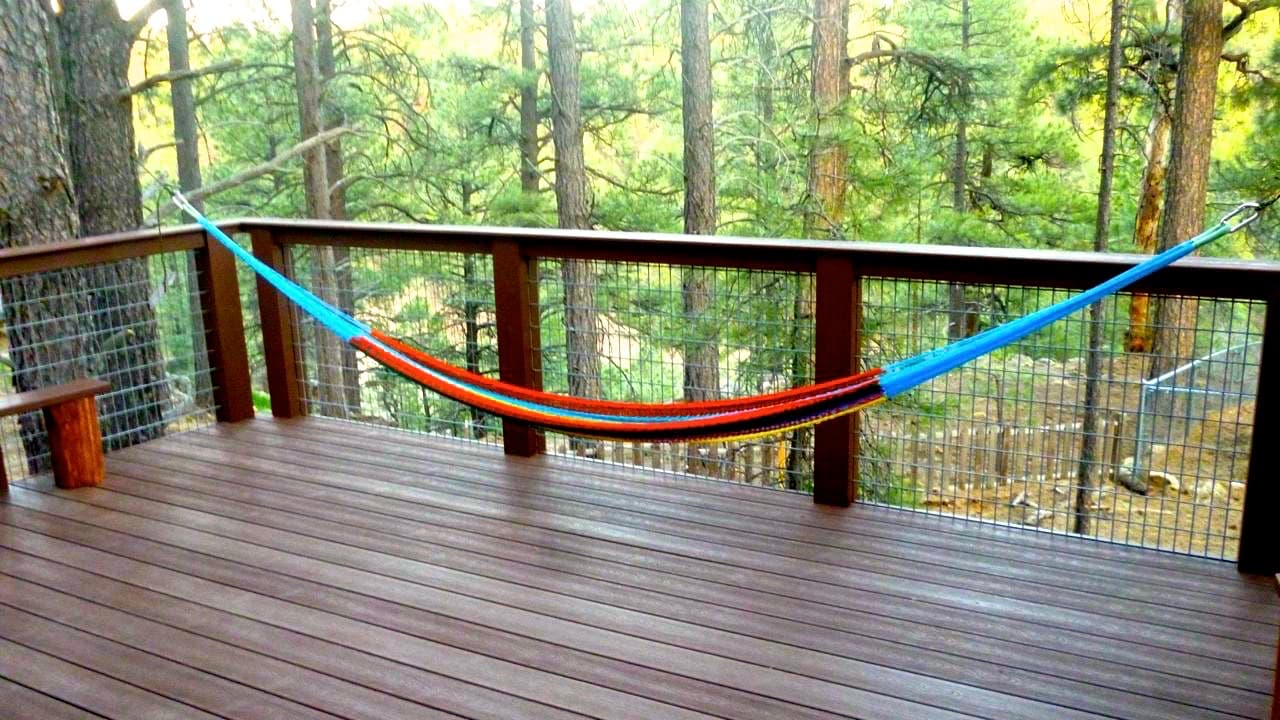 Hammock on cabin deck in the pines
