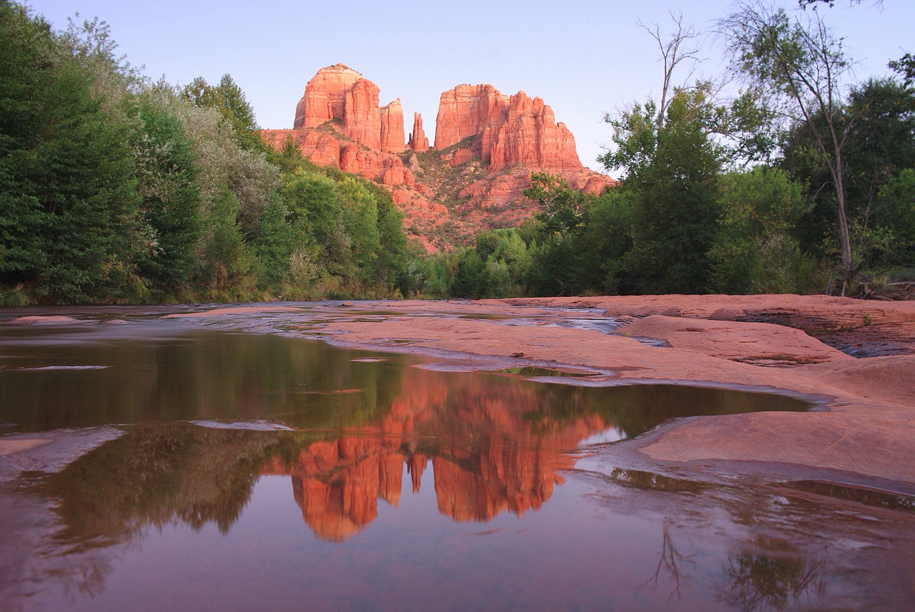 Cathedral Rock reflected in the water at Red Rock Crossing, Sedona, at sunset