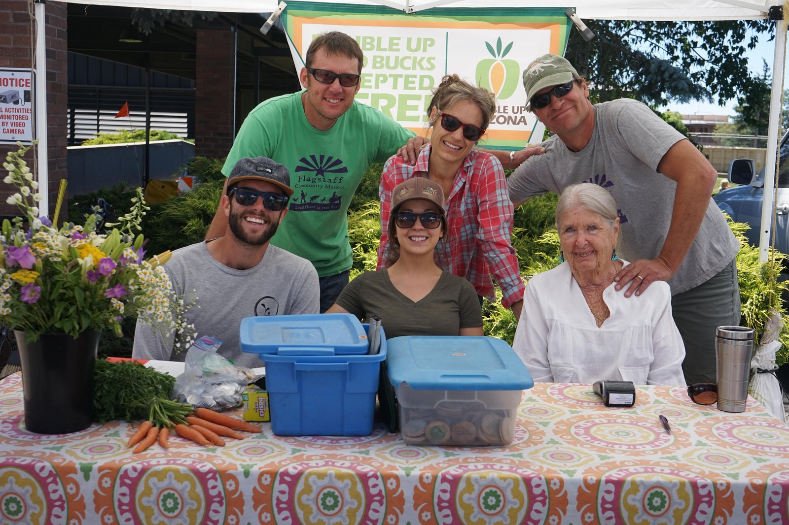 Vendors with fresh produce at the Flagstaff Community Farmers Market